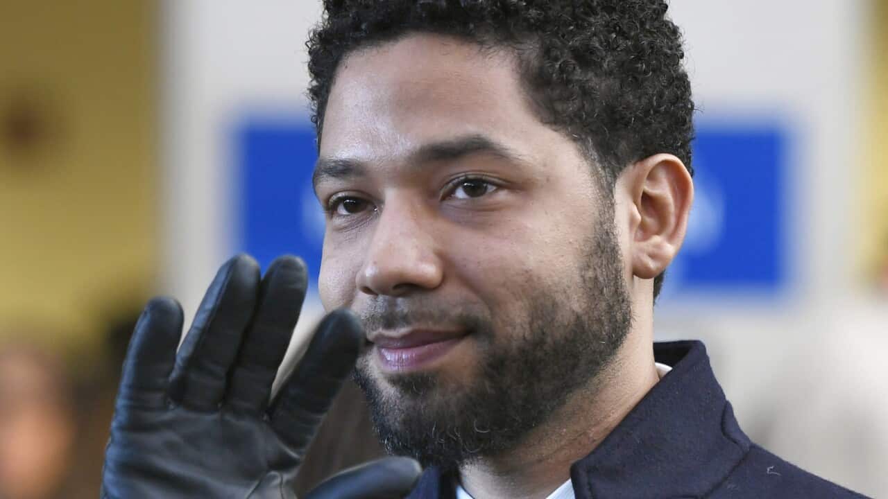 Actor Jussie Smollett smiles and waves to supporters after his charges were dropped in Chicago last month.