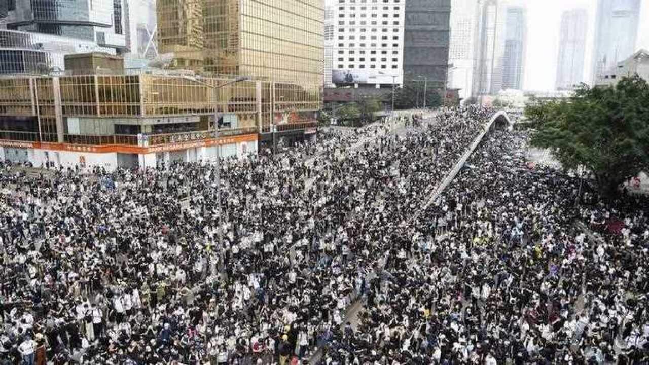 Scenes from Hong Kong, where the disruption by protesters has forced the government to delay the bill debate