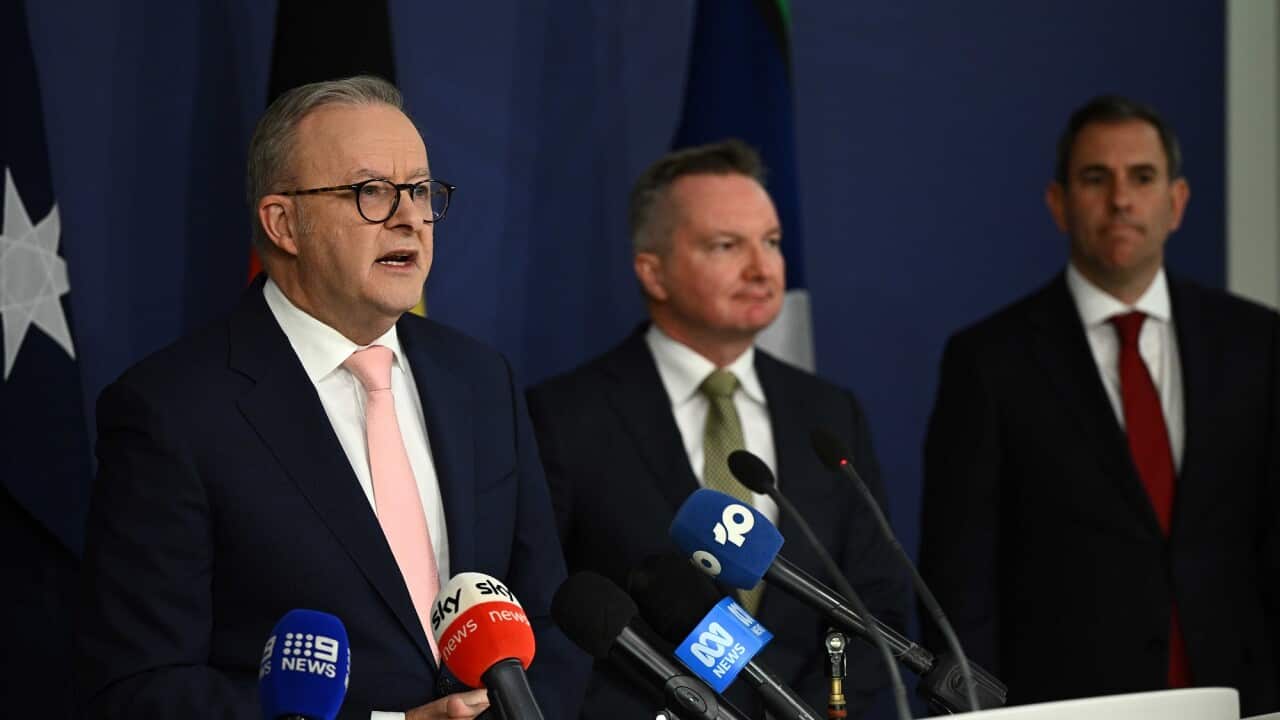 Prime Minister Anthony Albanese, Minister for Climate Change and Energy Chris Bowen and Treasurer Jim Chalmers speaking at the lectern.
