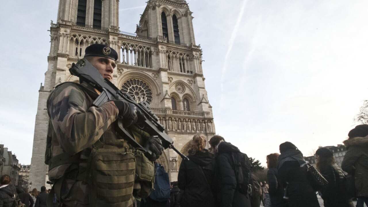 A soldier patrols at the Notre Dame cathedral in Paris