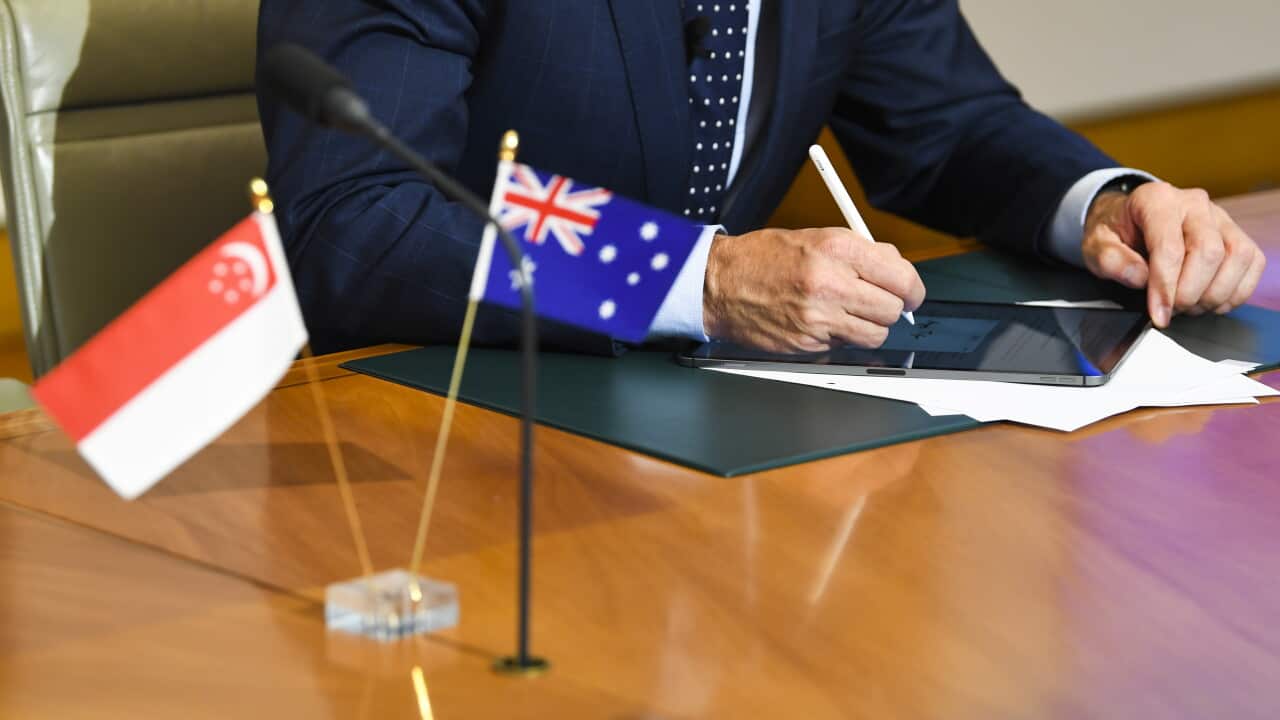ANGUS TAYLOR SINGAPORE SIGNING CEREMONY