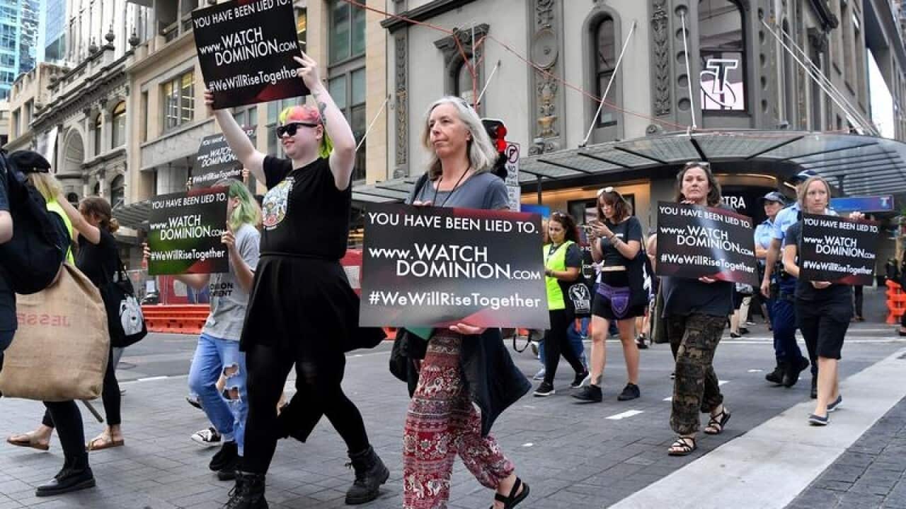 Animal rights protesters march through the business district in Sydney.