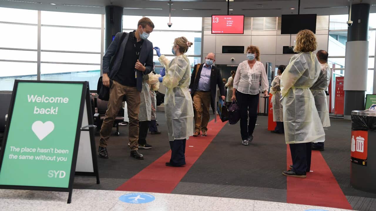 With the first passengers from Melbourne arriving in Sydney passengers on a flight from Canberra are tested for COVID-19 symptoms by NSW Health staff at Sydney Airport, Sydney, Monday, November 23, 2020. Border restrictions were lifted between NSW and Vic
