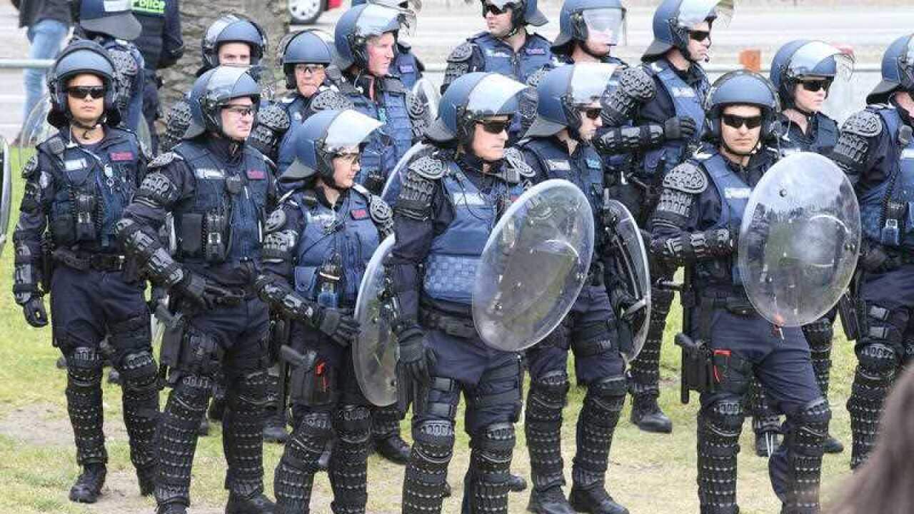 Scores of police out in force on Melbourne's St Kilda foreshore as both far-right and anti-racism groups gather.