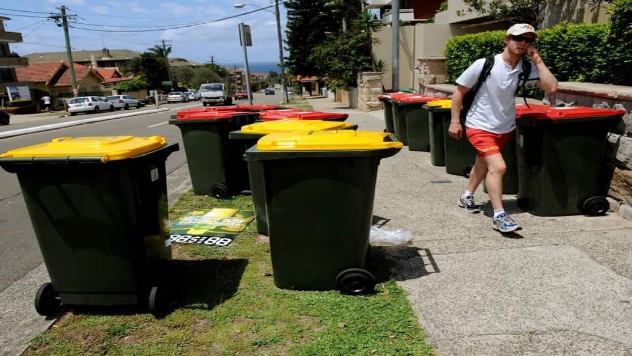 Recycling bins on a street in Melbourne.