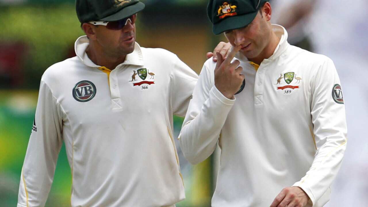 Cricketers Michael Clarke (R) and Ricky Ponting