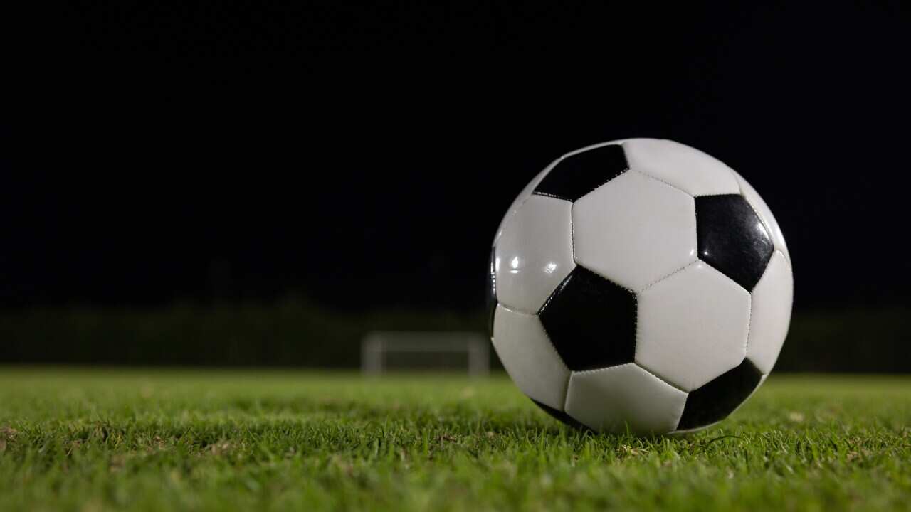 Soccer ball on the ground at a football field