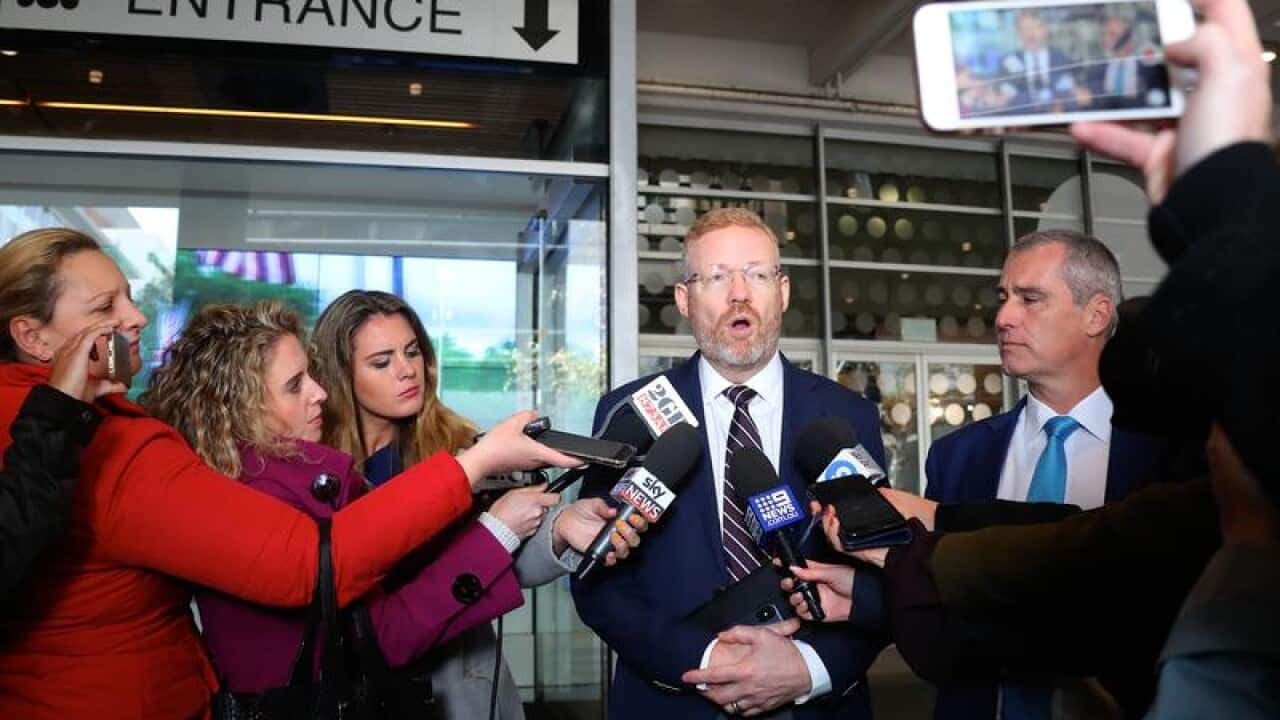 ABC Editorial Director Craig McMurtie (C) has called the AFP raid an "uncomfortable development".