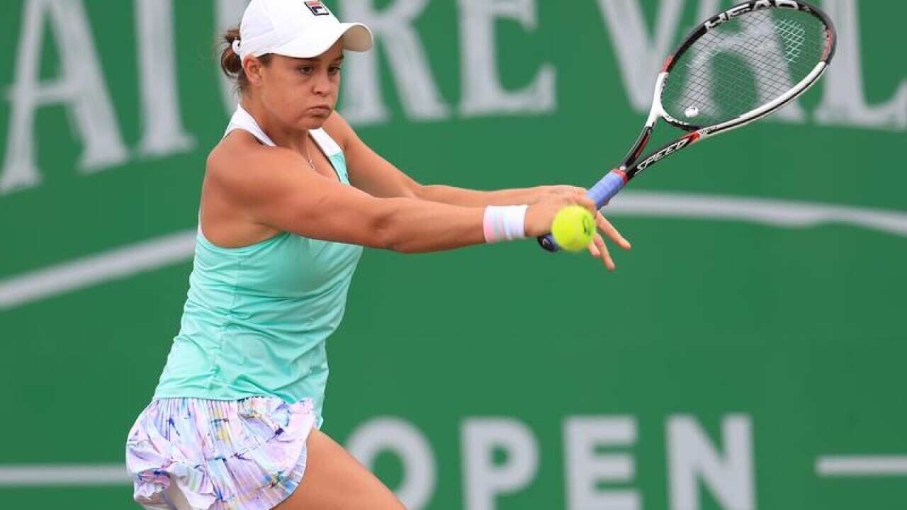 Ashleigh Barty returns a shot during the semi-final