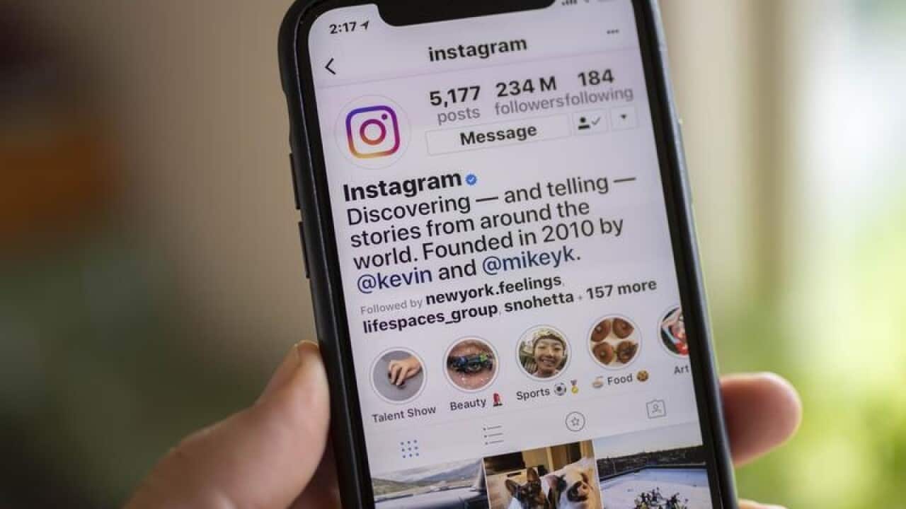 A smart phone is seen displaying the social media app Instagram