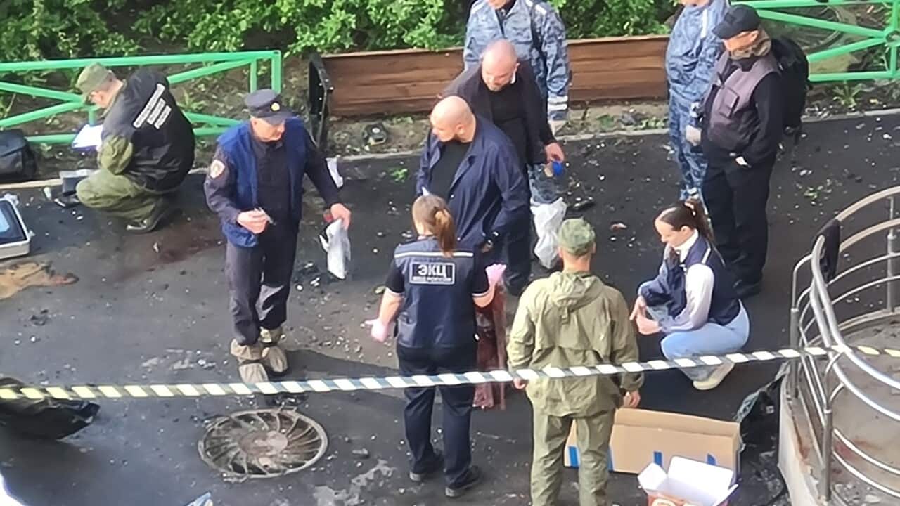 A group of investigators working at the scene of an explosion.