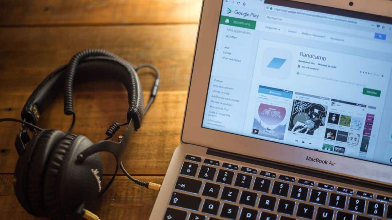 The BandCamp application is seen displayed on a laptop monitor