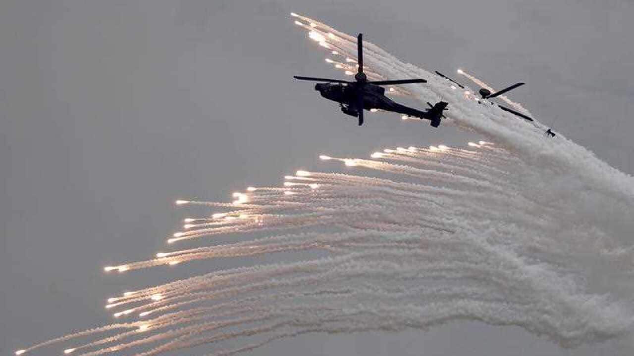 AH-64E attack helicopters launch flares during the 36th Han Kuang (Chinese Glory) military exercise in Taichung, Taiwan, 16 July 2020