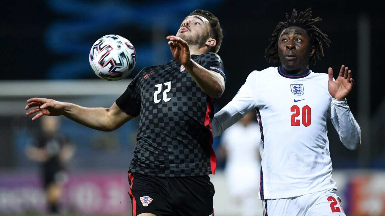 Mario Vuskovic of Croatia and Eberechi Eze of England battle for the ball during the 2021 UEFA European Under-21 Championship Group D match between Croatia and England at Bonifika Stadium on March 31, 2021 in Koper, Slovenia.