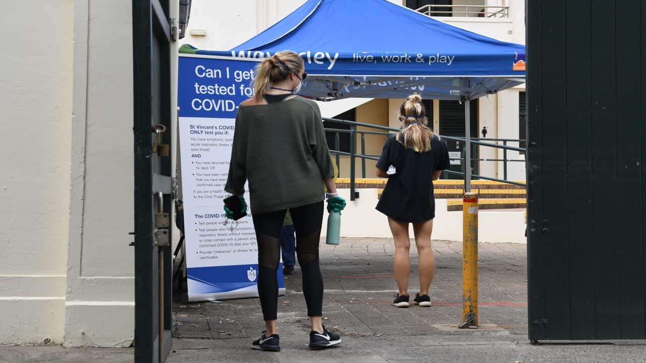 Nursing staff from St. Vincents Hospital see local residents and backpackers at a COVID-19 testing clinic in the Bondi Pavillion on Bondi Beach.