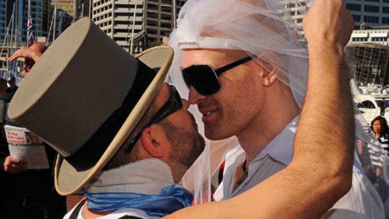 gay_marriage_kiss_grooms_091111_B_getty_641711683