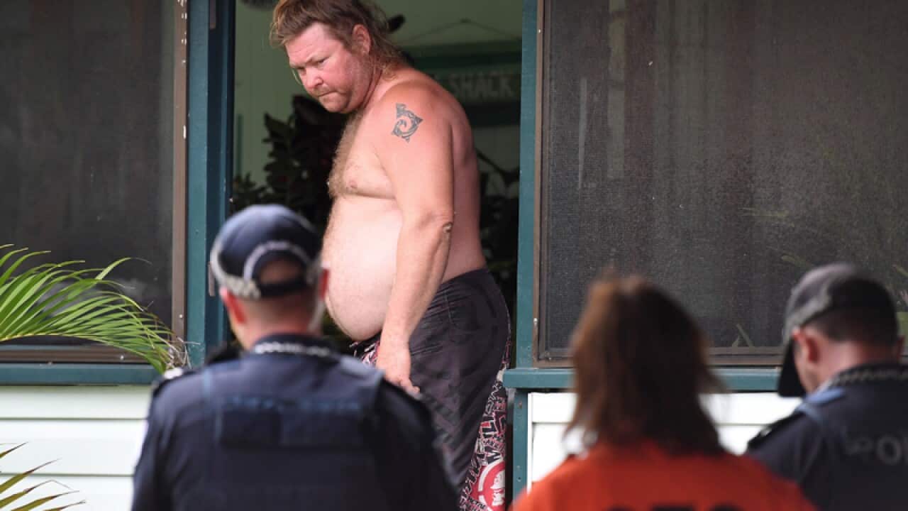 police and SES advise a resident to evacuate a low lying area of Ayr