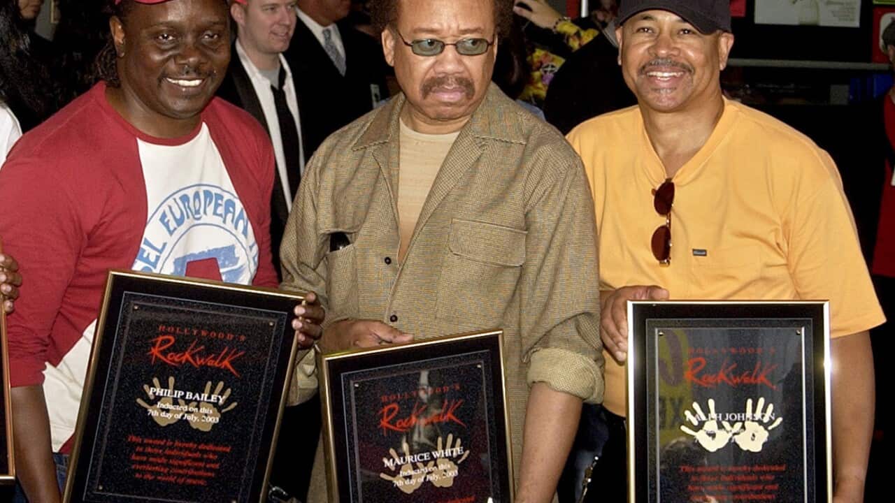 In this July 7, 2003 file photo, Philip Bailey, from left, Maurice White, and Ralph Johnson, of Earth Wind & Fire hold up the plaques from their induction at the Hollywood Rock Walk at a ceremony in Los Angeles. (AP)