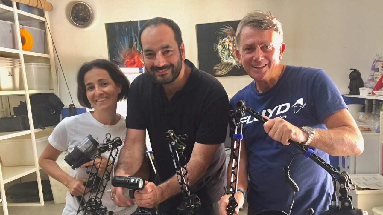 Gaetano Gargiulo with his wife and a friend with scuba equipment.