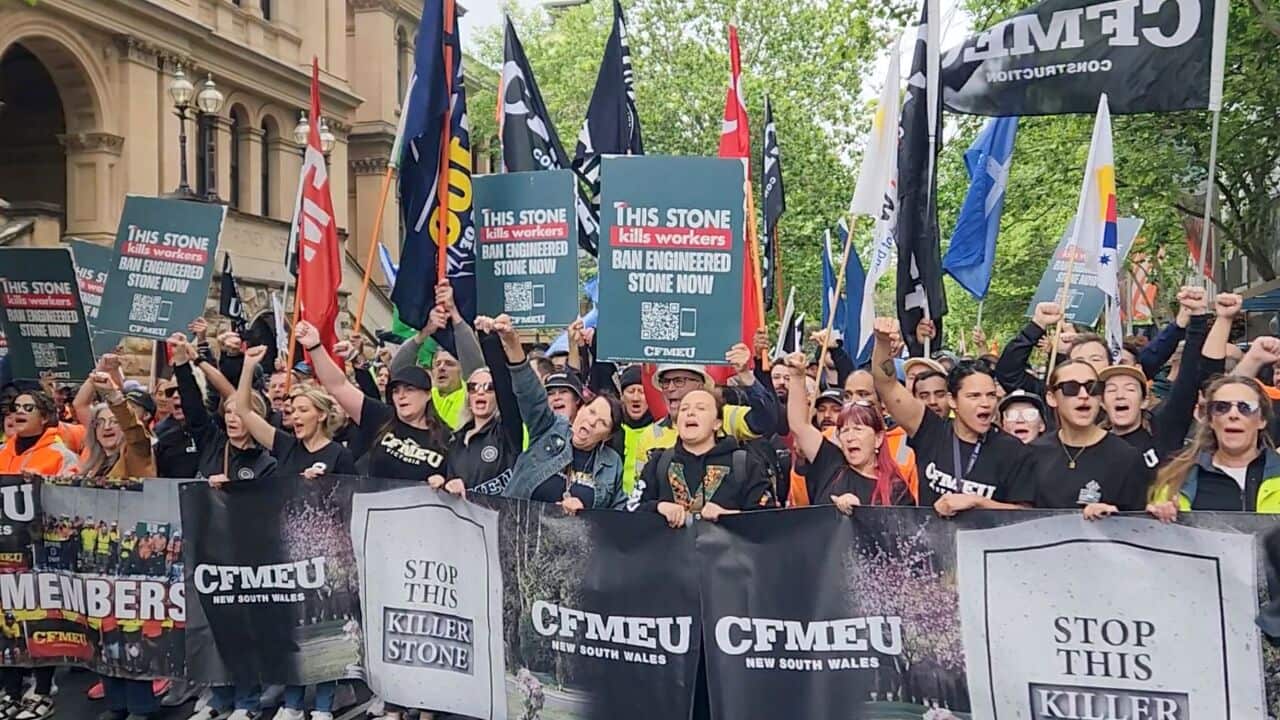 Workers at a CFMEU rally in Sydney demand engineered stone be banned (AAP).jpg