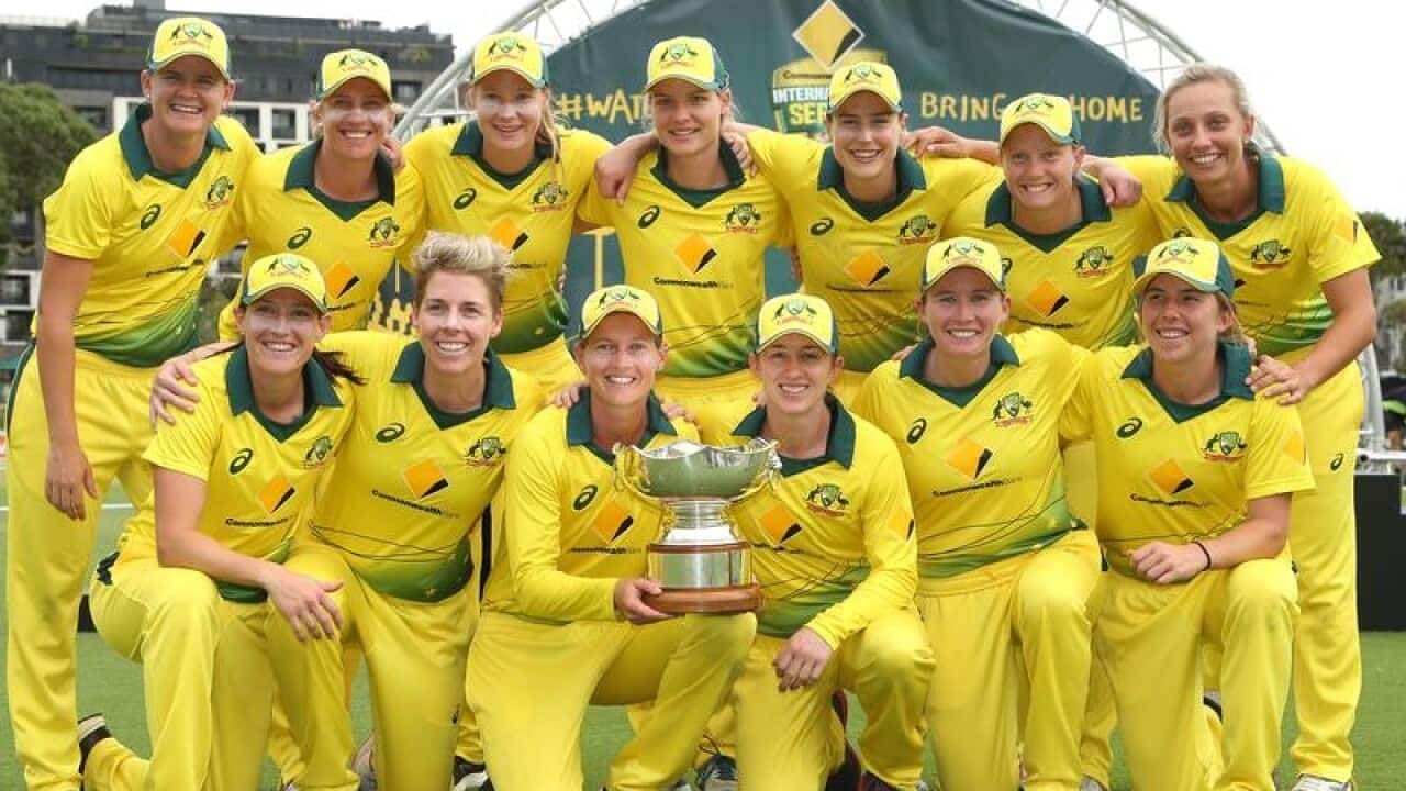 Australia celebrate with the trophy after the women's ODI match