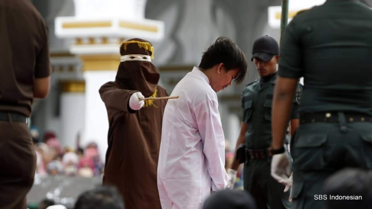 A man is publicly whipped as punishment for being in a same-sex relationship, Banda Aceh, May 2017 - AAP.