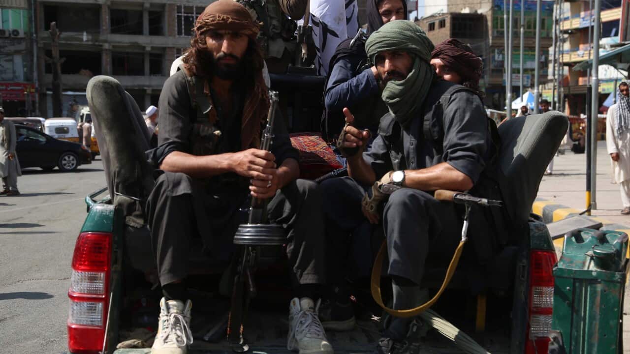Taliban fighters patrol in Jalalabad