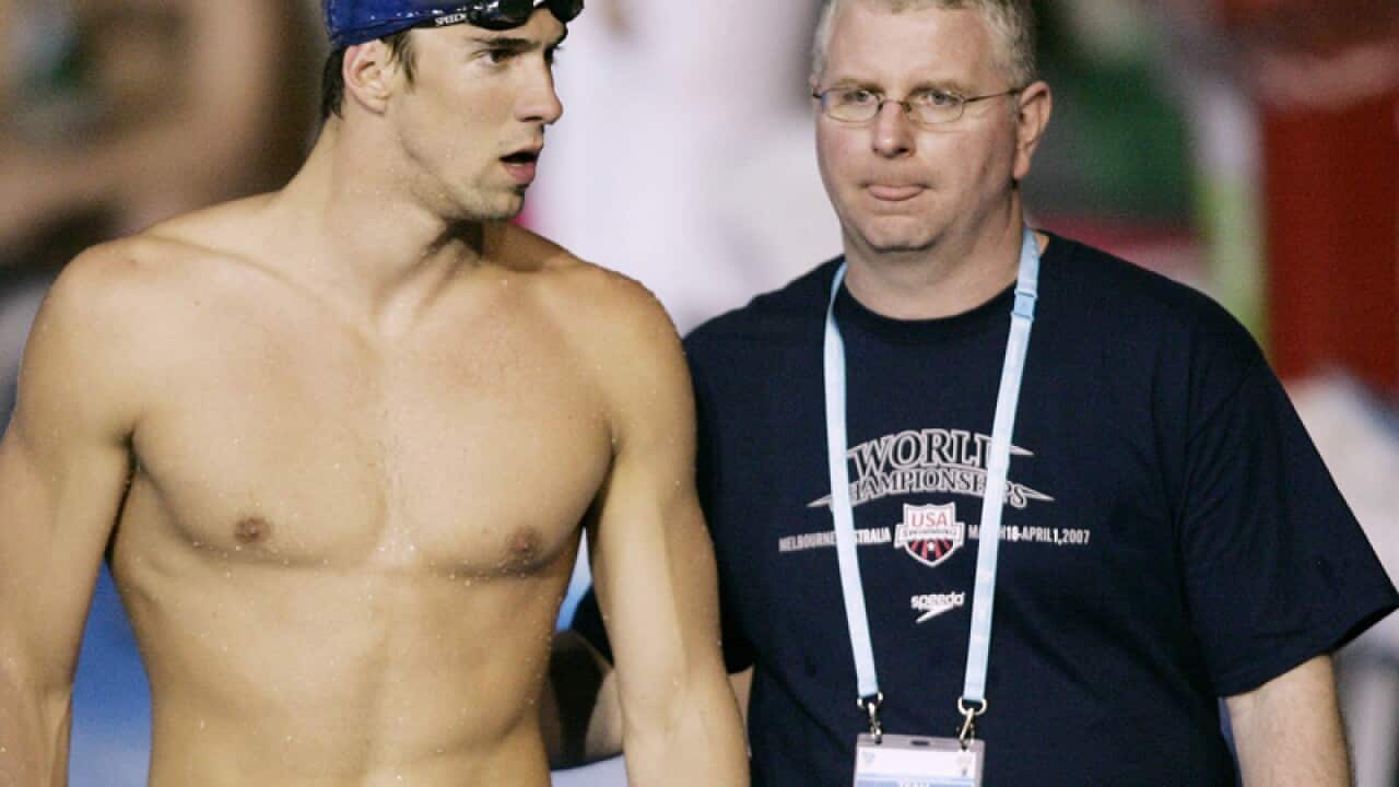 US swimming star Michael Phelps (L) and former coach Bob Bowman