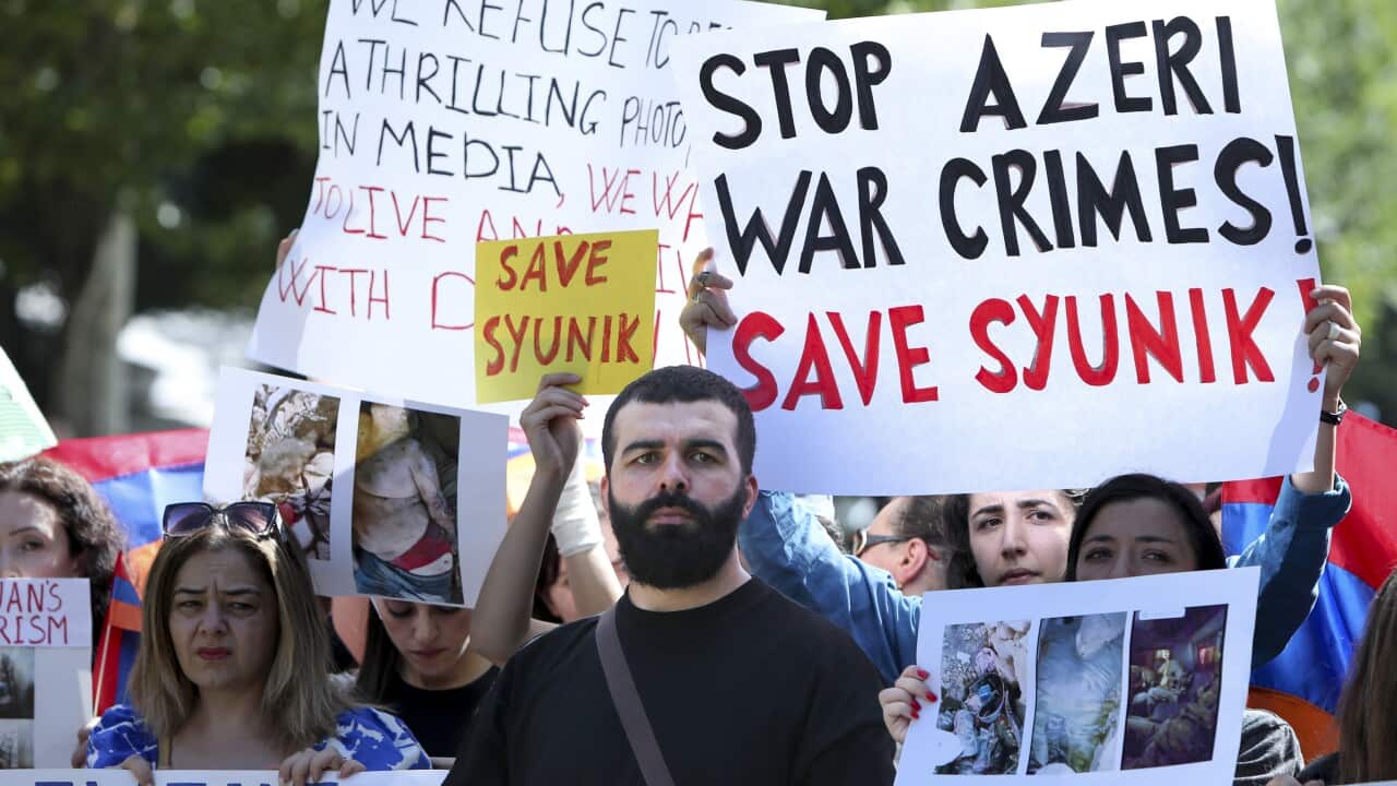 Demonstrators outside the centre where Nancy Pelosi was speaking, in Yerevan, Armenia