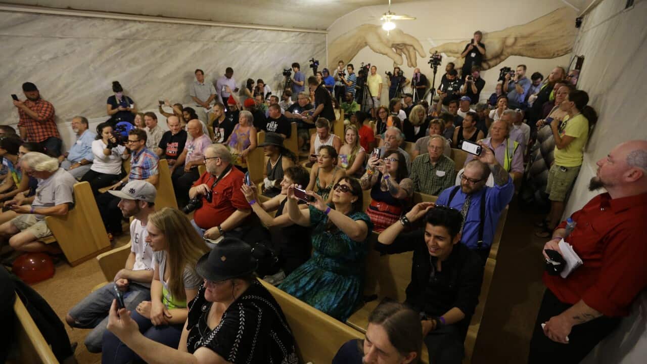 Members of the congregation at First Church of Cannabis sing and dance during the church's first service in Indianapolis.