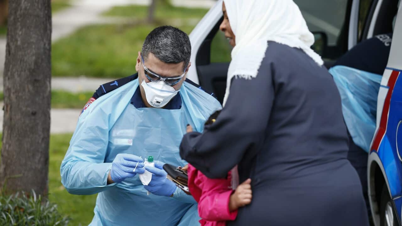 Paramedics perform COVID19 tests in Broadmeadows, Victoria.