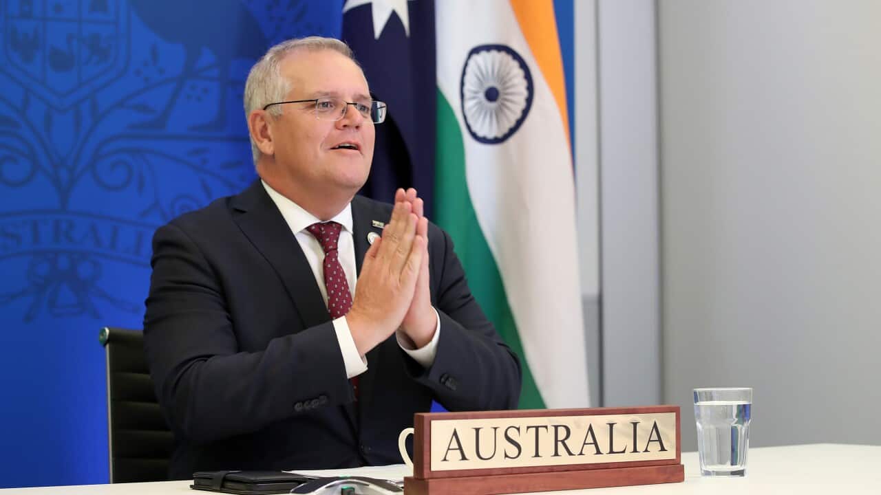 Australian Prime Minister Scott Morrison speaks with Indian Prime Minister Narendra Modi during a virtual leaders' summit in Brisbane, Monday, March 21, 2022. (AAP Image/Jono Searle) NO ARCHIVING