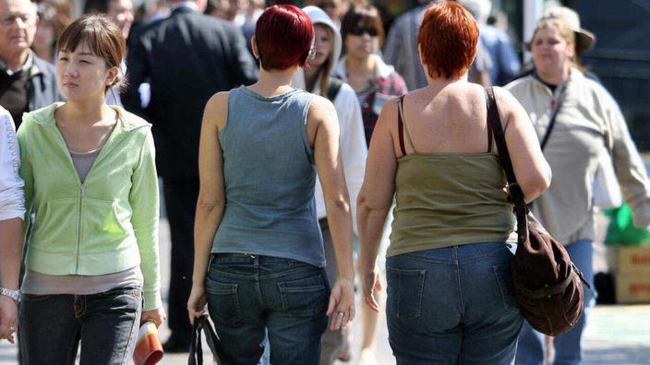 Pedestrians walk through Circular Quay in Sydney