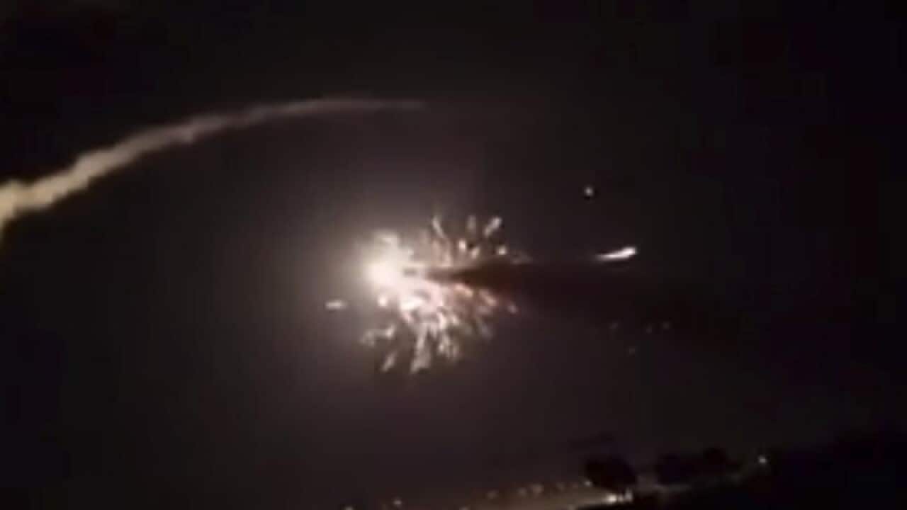 Part of a video shows missiles flying into the sky near Damascus