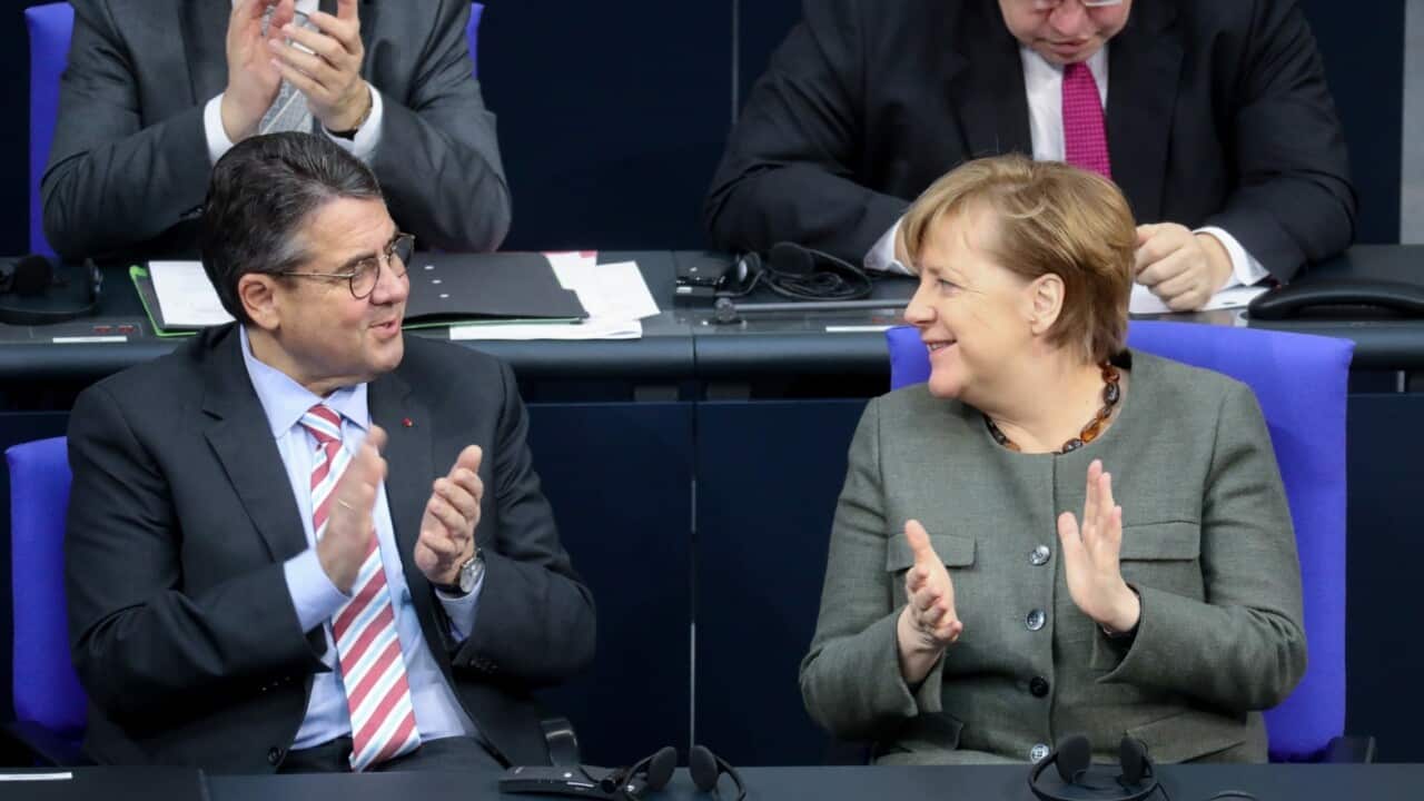 File: German Chancellor Angela Merkel (R) and Foreign Minister Sigmar Gabriel 