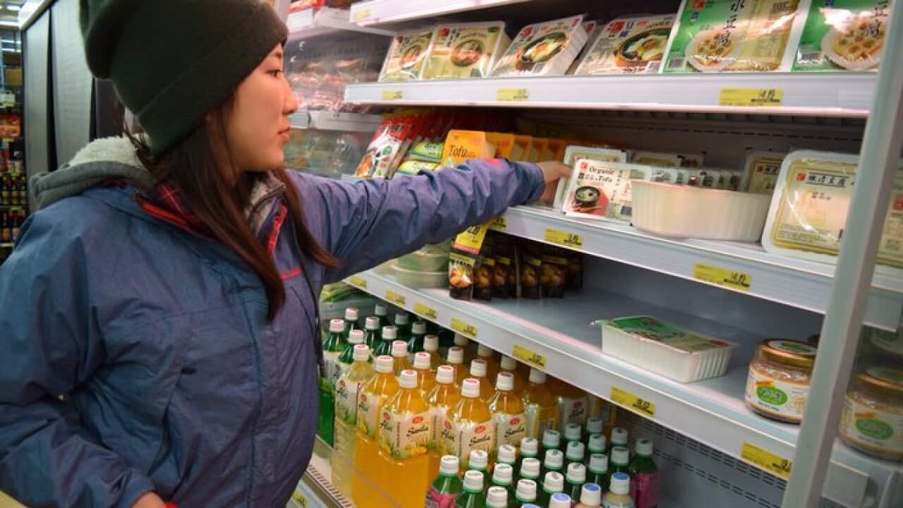 Japanese backpacker shopping