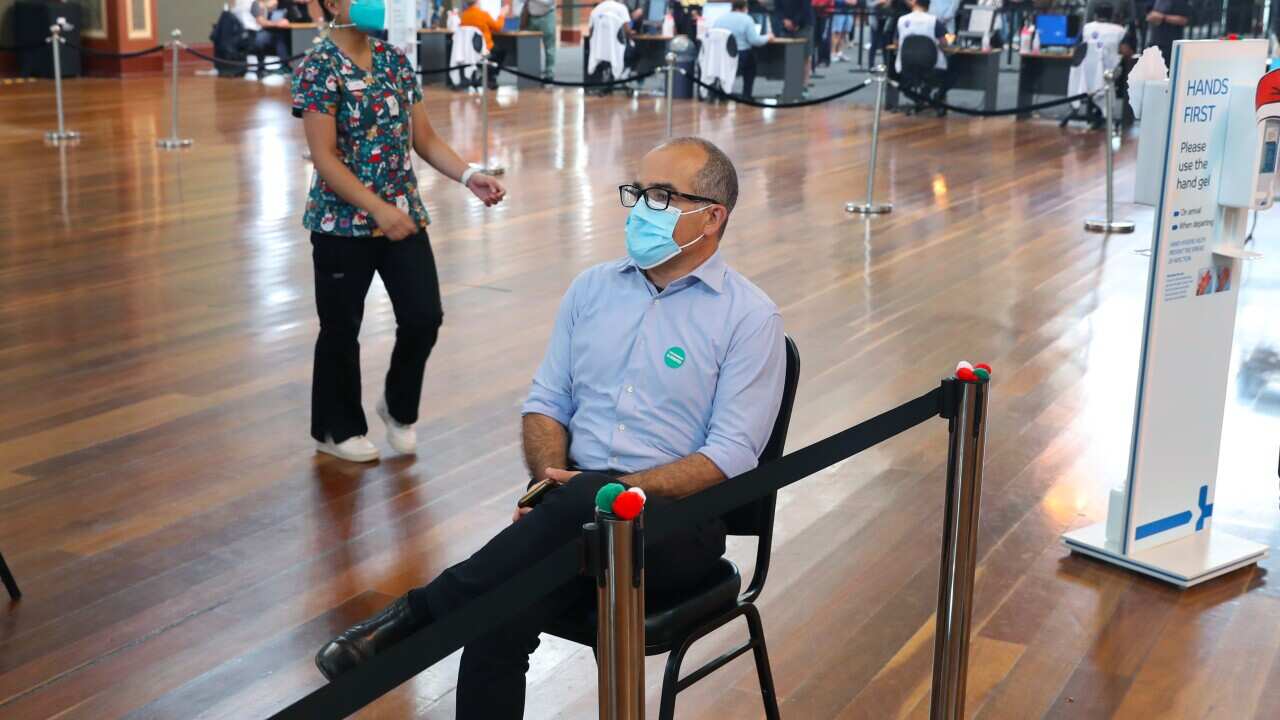 Acting Victorian Premier James Merlino receives a Covid-19 booster vaccination at the Royal Exhibition Building in Melbourne, Thursday, December 23, 2021. (AAP Image/Pool, David Crosling) NO ARCHIVING