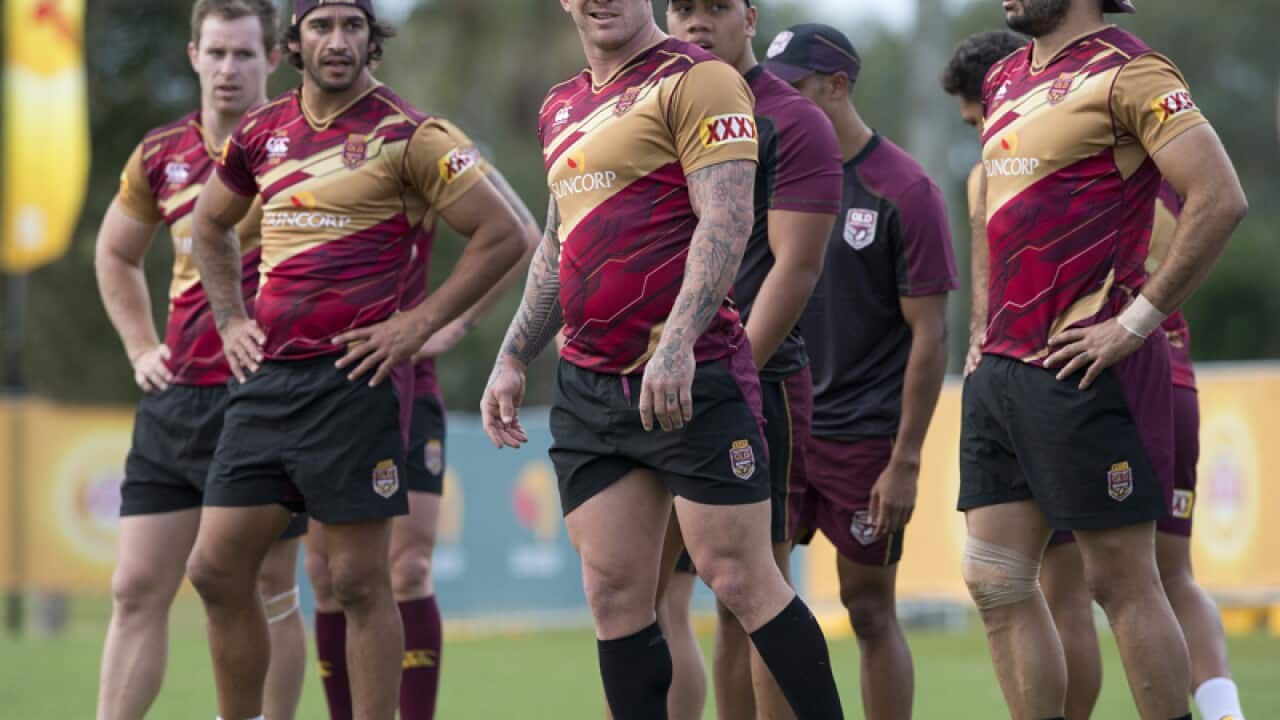 Josh McGuire (C) looks on during the Qld State of Origin training