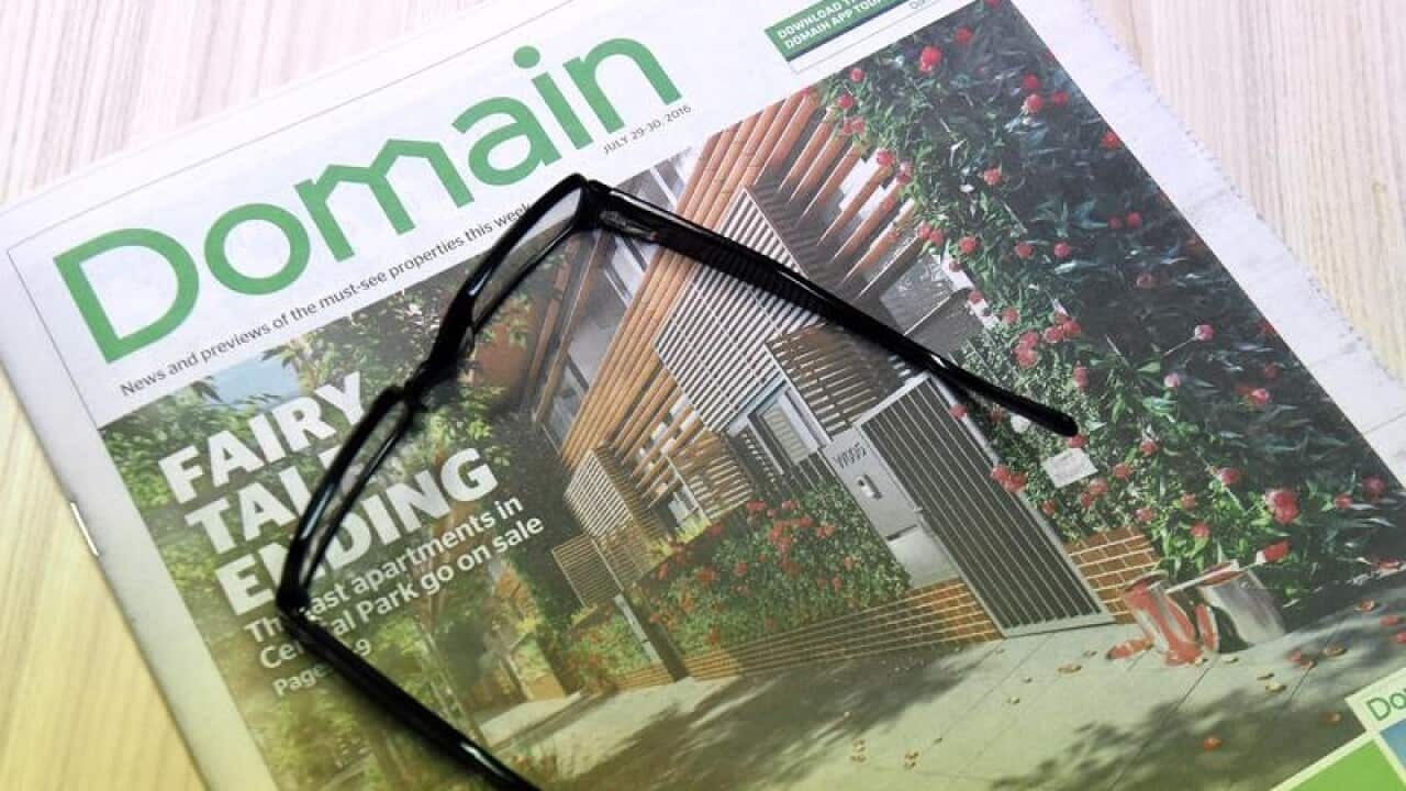 Fairfax's Domain real estate liftout is seen on a table in Sydney.