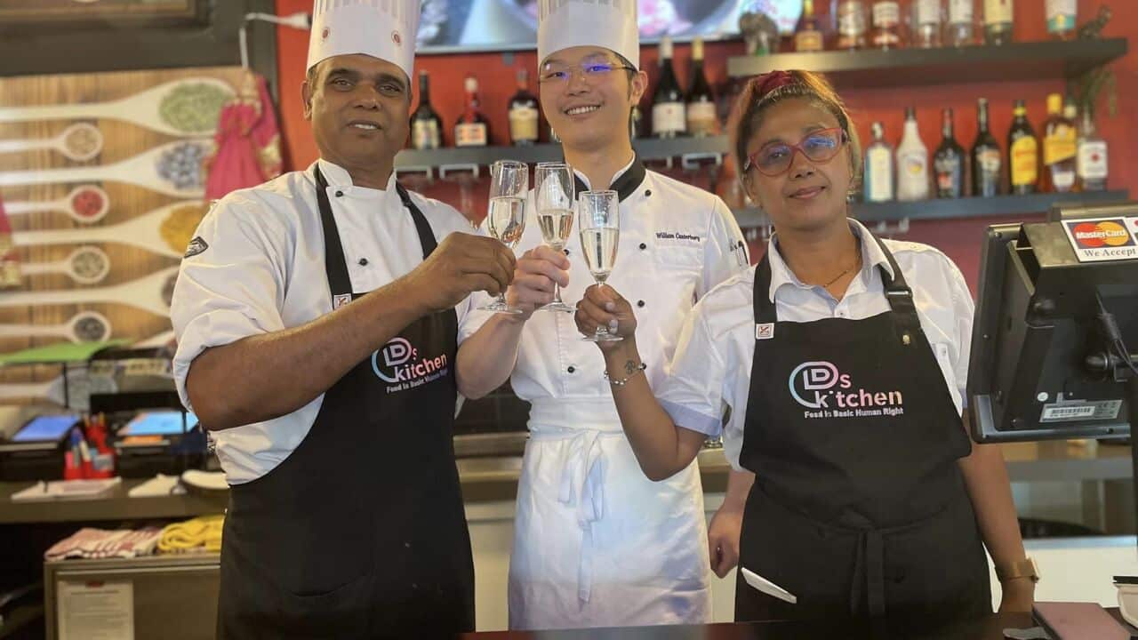 Daman Shrivastav (left), his head chef and his wife at India @ Q by DDs Kitchen.