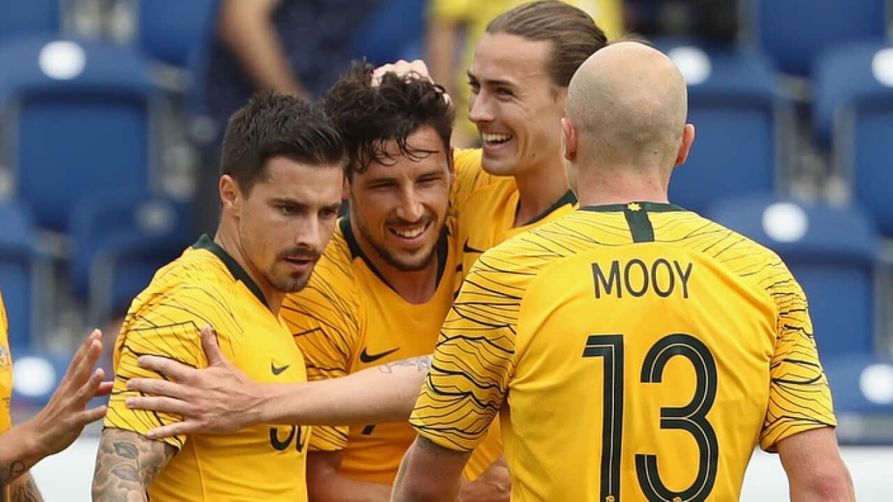Mathew Leckie celebrates after scoring his second goal in Australia's friendly match against the Czech Republic in Austria