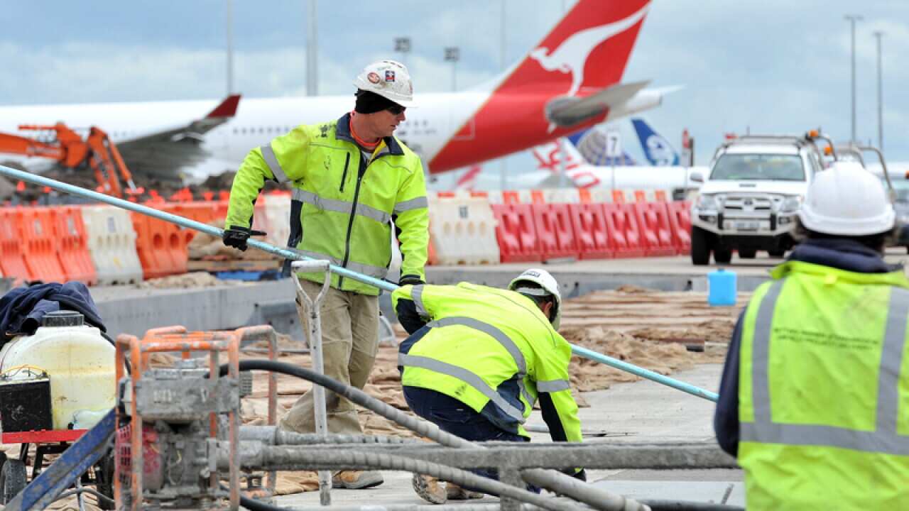 Construction workers perform duties at Melbourne Airport