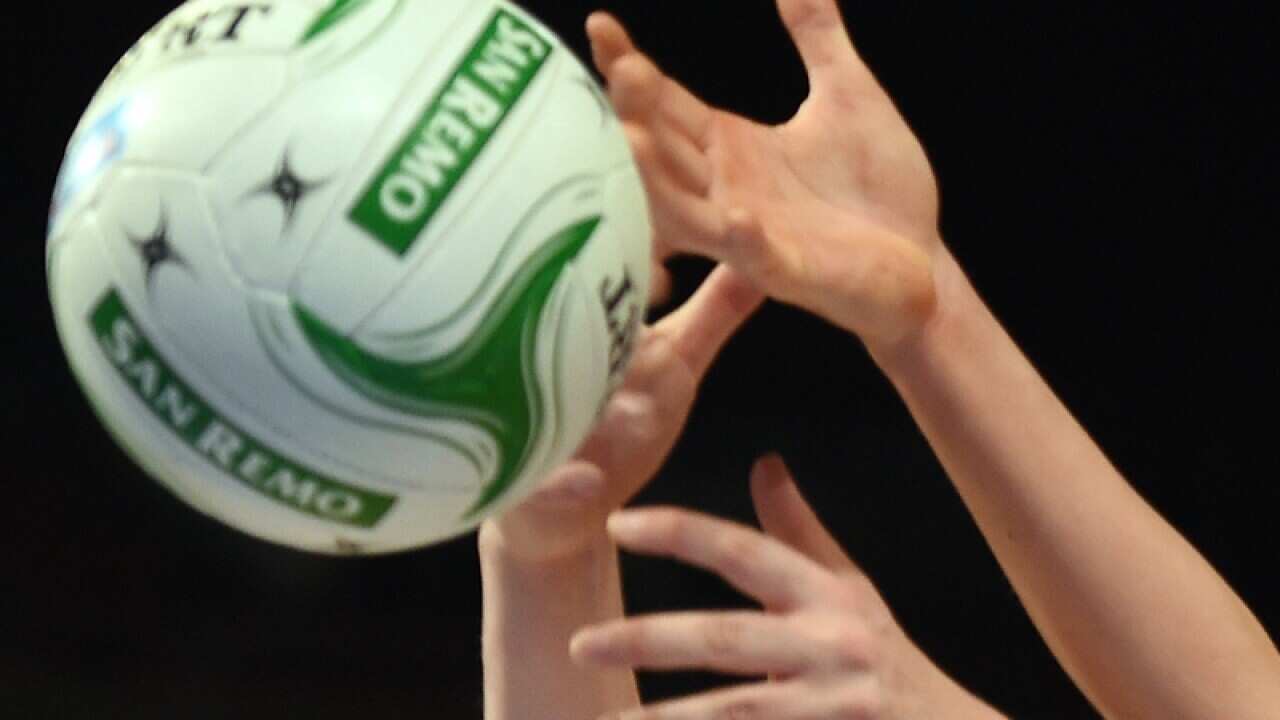 Netballers contest for the ball