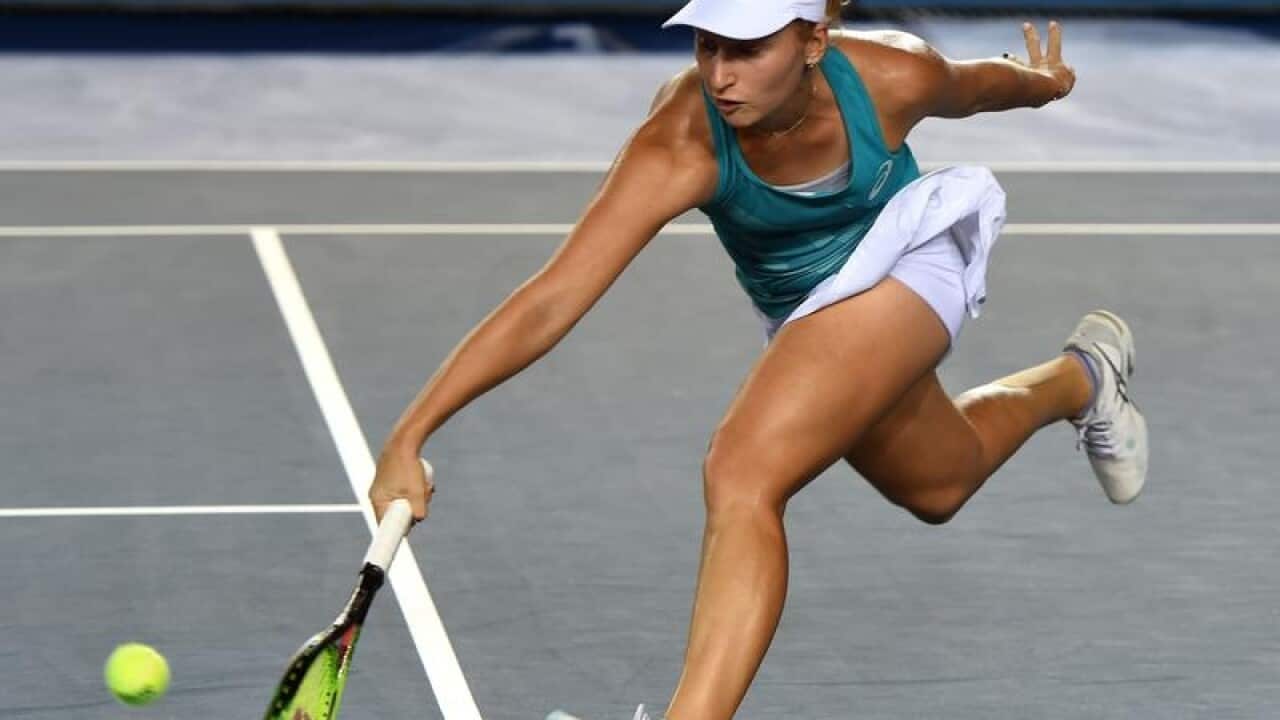 Daria Gavrilova of Australia returns a shot