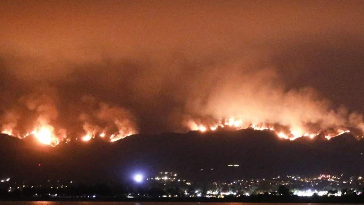 A wildfire burns in the Cleveland National Forest