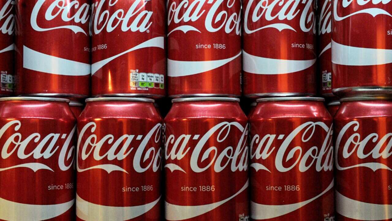 Cans of Coca-Cola in a supermarket