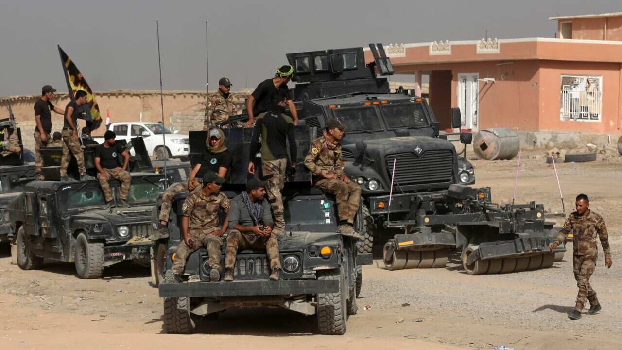 Iraq's elite counterterrorism forces gather ahead of an operation to re-take the Islamic State-held City of Mosul, outside Irbil, Iraq, Saturday, Oct. 15, 2016.