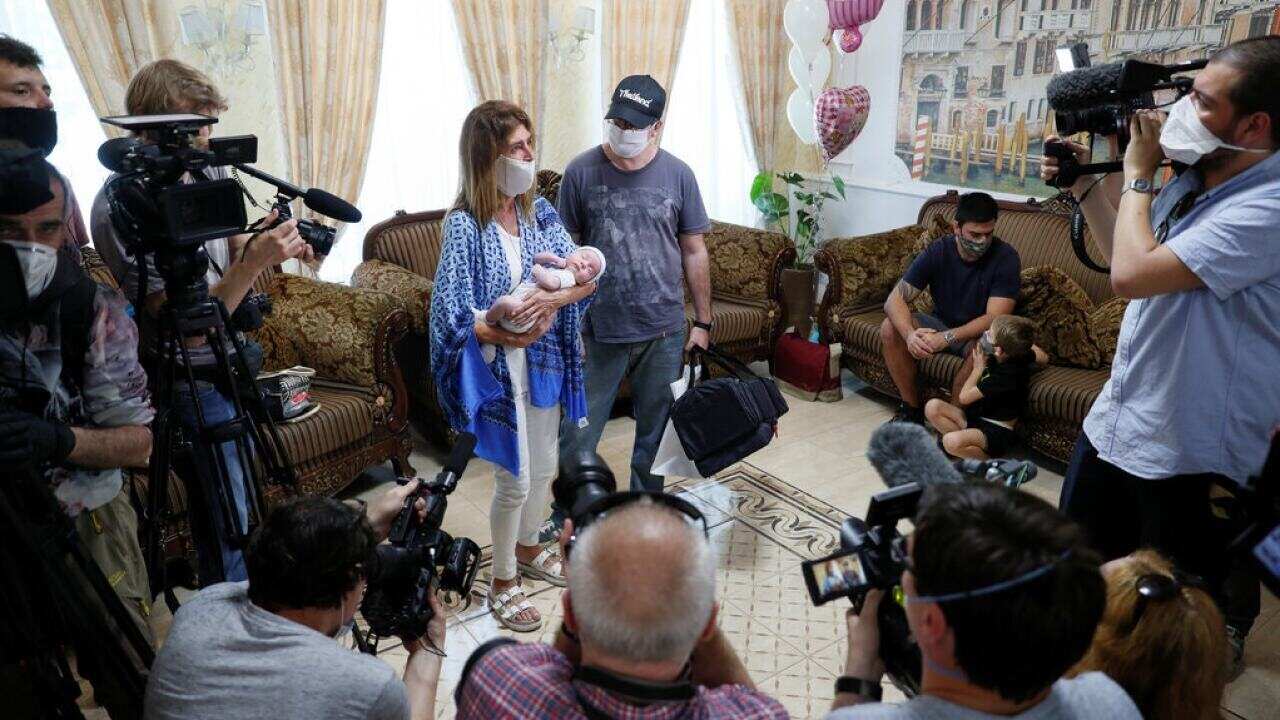 Andrea Diez and Fernando Montero, Argentine citizens and parents of newborn Ignacio, addressing the news media in Kyiv, Ukraine, on Wednesday.(Reuters)