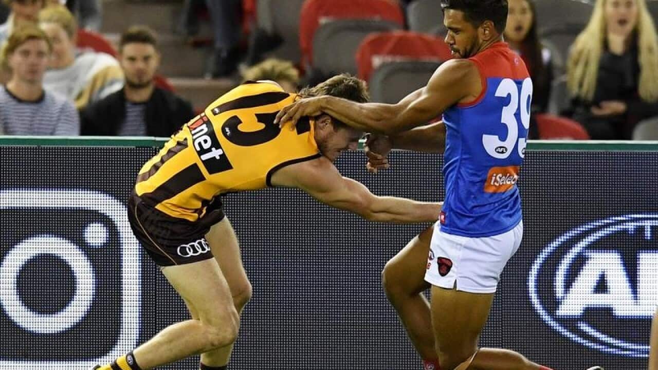 Neville Jetta tackles Blake Hardwick.