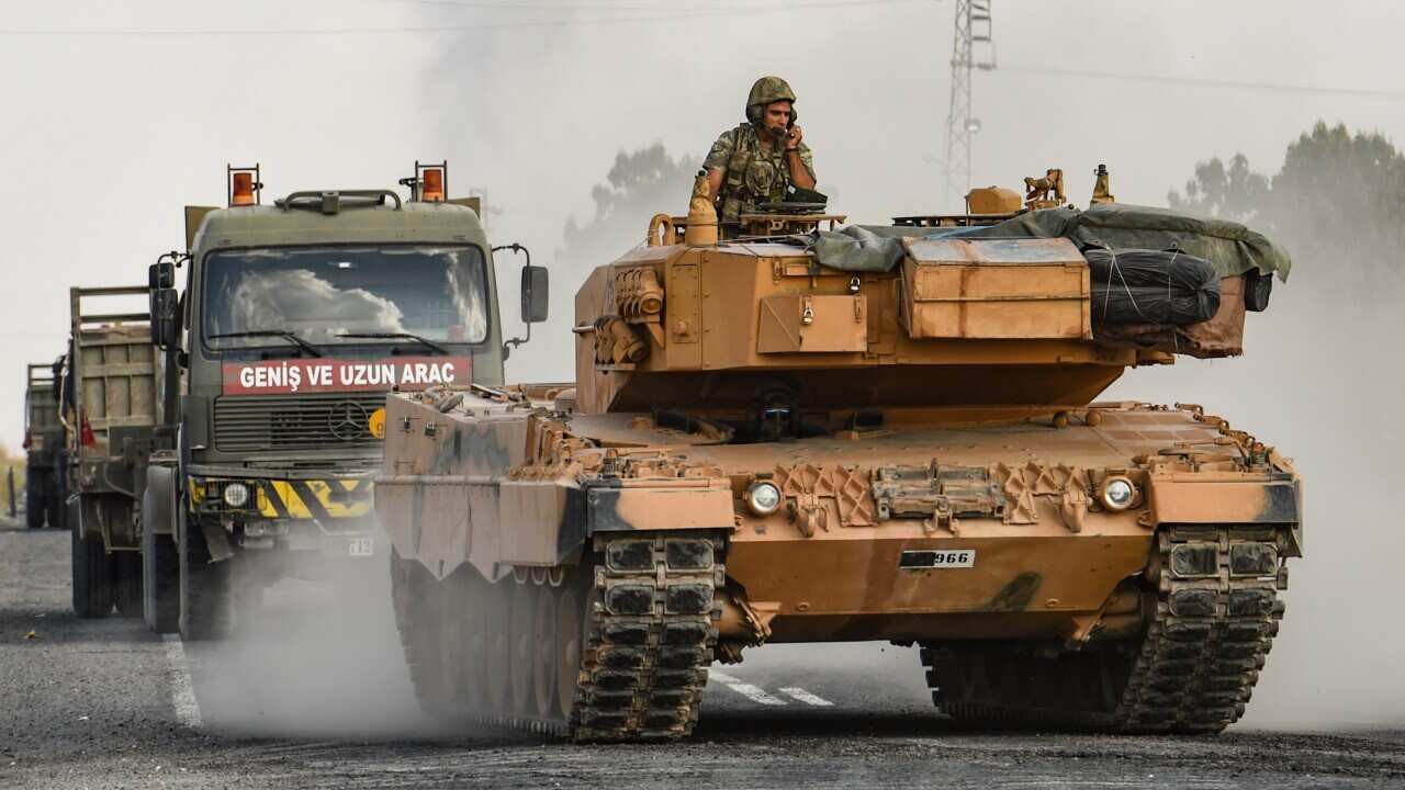 Turkish forces appeared to continue shelling targets in Northern Syria despite claims Turkey had agreed to a ceasefire in its assault on Kurdish-held towns.